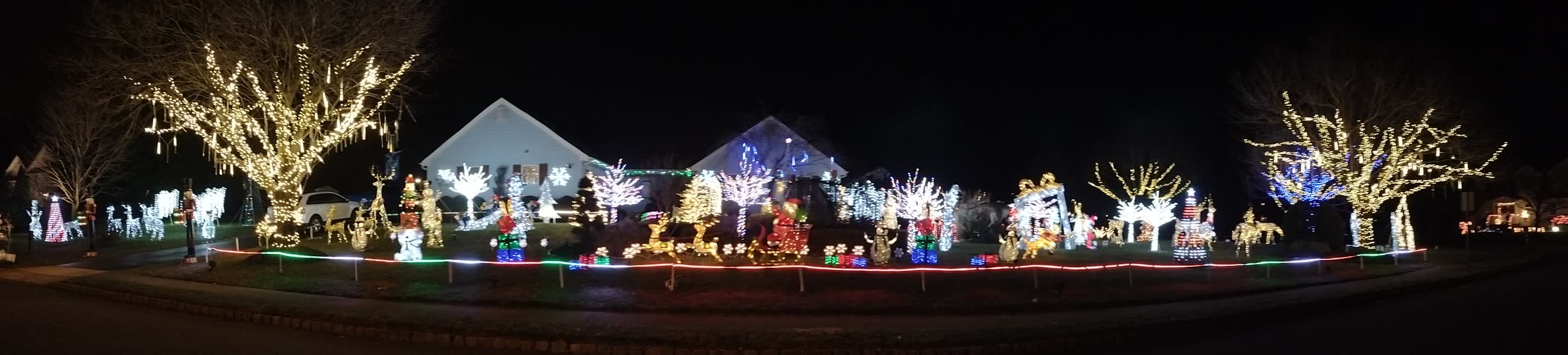 Panorama of the whole property lit up along Silvercrest Drive